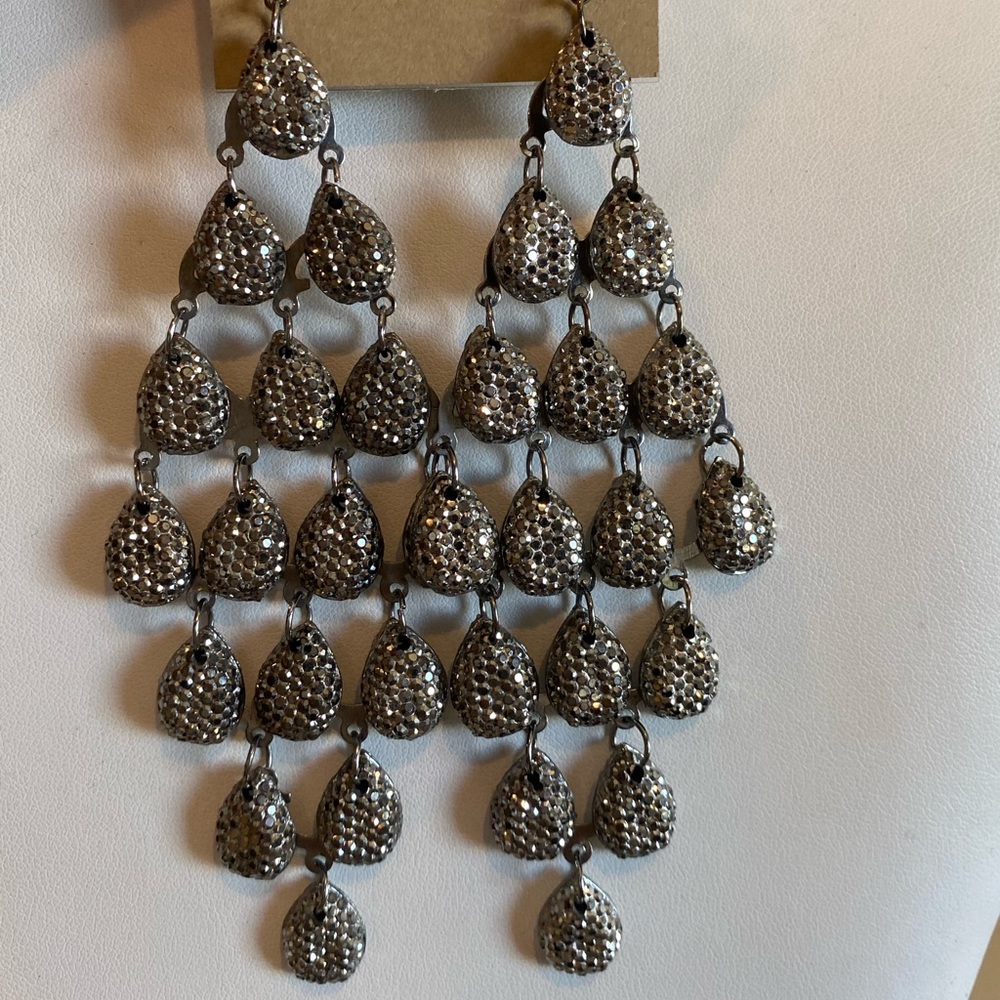 Carole Inc long earrings